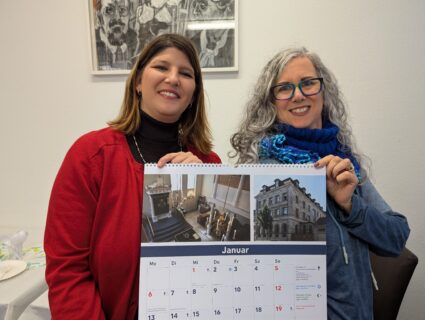 Ms. Gabriel (granddaughter of Dr. Isaak Hallemann) and Ms. Scheuerer with the Interreligious Calendar